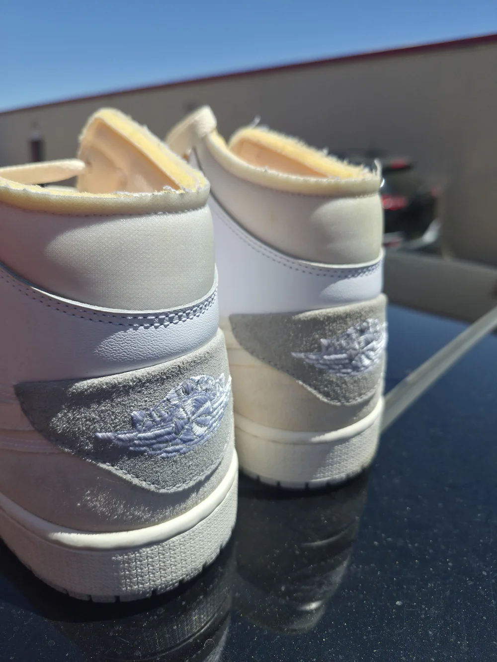 Jordan Men's 1 Mid Top Sneakers in Cream and White